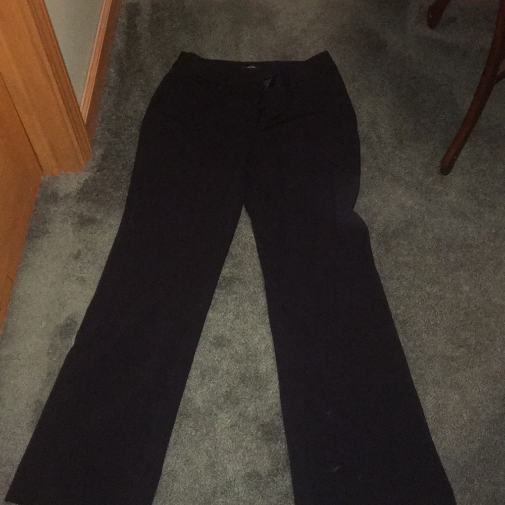 Plain black dress pants barely warn.